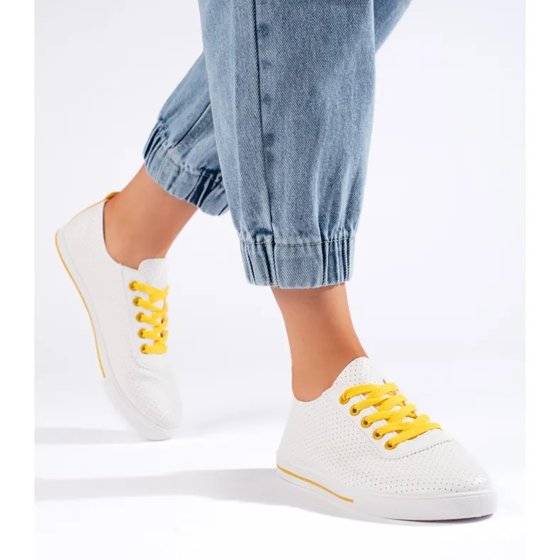 White women's sneakers with yellow laces