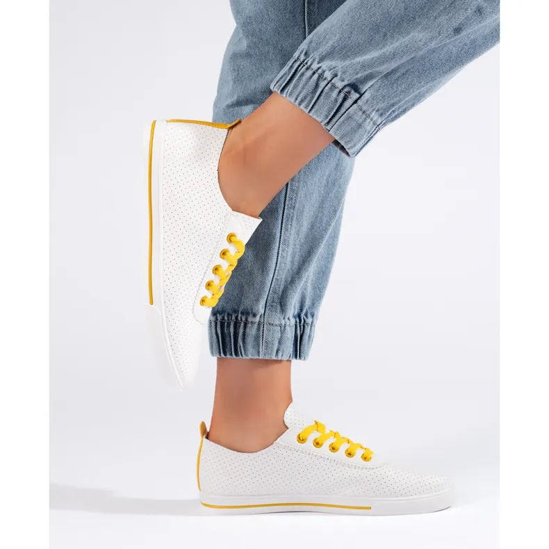 White women's sneakers with yellow laces